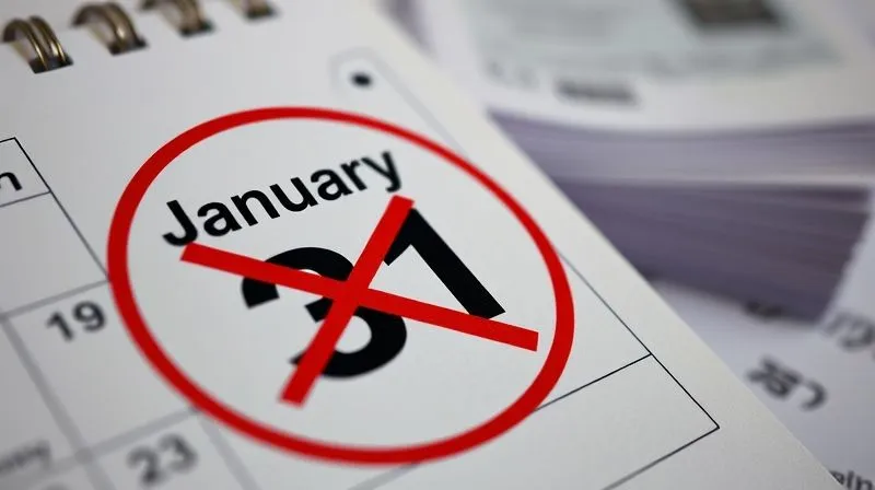 photorealistic, professional photography, 8K, cinematic lighting, sharp focus, depth of field, shot on a high-end DSLR, a close-up of a calendar with January 31st circled prominently, a red 'X' through it, conveying a missed deadline, with a stack of 1099-NEC forms slightly out of focus in the background, a sense of urgency.